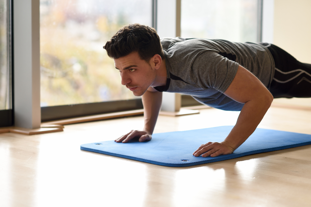 Man doing a push-up at home